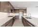 Modern kitchen with stainless steel appliances and custom cabinetry at 10249 E Ulysses Ave, Mesa, AZ 85212