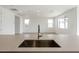 Modern kitchen sink and faucet with light-colored countertop at 10249 E Ulysses Ave, Mesa, AZ 85212