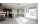 Open concept kitchen with island, stainless steel appliances, and access to patio at 10249 E Ulysses Ave, Mesa, AZ 85212