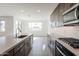 Modern kitchen with island, stainless steel appliances, and view to backyard at 10249 E Ulysses Ave, Mesa, AZ 85212