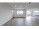 Spacious living room with large windows and tile flooring at 10249 E Ulysses Ave, Mesa, AZ 85212