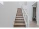 Modern staircase leading to upper level with metal railing at 10249 E Ulysses Ave, Mesa, AZ 85212