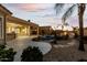 Peaceful backyard with pool, landscaping and a view of the house at 10310 E Posada Ave, Mesa, AZ 85212