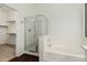 Bathroom featuring a shower and soaking tub, with adjacent closet at 10310 E Posada Ave, Mesa, AZ 85212