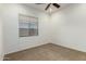 Bright bedroom featuring a large window and neutral wall colors at 10310 E Posada Ave, Mesa, AZ 85212