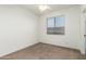 Simple bedroom with ceiling fan and window coverings at 10310 E Posada Ave, Mesa, AZ 85212