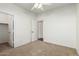 Bedroom with ceiling fan and access to closet and hallway at 10310 E Posada Ave, Mesa, AZ 85212