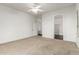 Bright bedroom with ceiling fan and carpet flooring at 10310 E Posada Ave, Mesa, AZ 85212