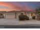 Beautiful one-story home with a two-car garage and landscaped front yard at 10310 E Posada Ave, Mesa, AZ 85212