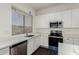 Modern kitchen with white cabinets and quartz countertops at 10310 E Posada Ave, Mesa, AZ 85212