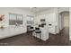Modern kitchen with white cabinets, island, and stainless steel appliances at 10310 E Posada Ave, Mesa, AZ 85212