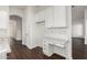 Kitchen features white cabinets and a built-in desk at 10310 E Posada Ave, Mesa, AZ 85212