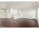Bright living room with dark laminate wood floors at 10310 E Posada Ave, Mesa, AZ 85212