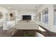 Spacious living room featuring a large TV and comfortable seating at 10310 E Posada Ave, Mesa, AZ 85212