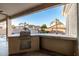 Outdoor kitchen area with a built-in grill and countertop at 10310 E Posada Ave, Mesa, AZ 85212