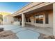 Covered patio with built-in grill and desert landscaping at 10310 E Posada Ave, Mesa, AZ 85212