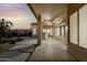 Spacious covered patio with outdoor kitchen and ceiling fan at 10310 E Posada Ave, Mesa, AZ 85212