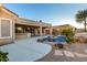 Relaxing pool area with patio, palm trees, and a built-in outdoor kitchen at 10310 E Posada Ave, Mesa, AZ 85212