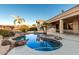 Relaxing kidney shaped pool with a waterfall feature at 10310 E Posada Ave, Mesa, AZ 85212