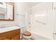 Bathroom includes a shower/tub combo, vanity, and wood cabinet at 10343 W Prairie Hills Cir, Sun City, AZ 85351