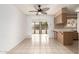 Kitchen with breakfast nook and access to sunroom at 10343 W Prairie Hills Cir, Sun City, AZ 85351