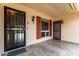 Front entrance with security door and tile flooring at 10343 W Prairie Hills Cir, Sun City, AZ 85351