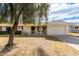 Ranch style home with carport and mature landscaping at 10343 W Prairie Hills Cir, Sun City, AZ 85351