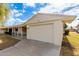 Single story home with attached garage and driveway at 10343 W Prairie Hills Cir, Sun City, AZ 85351