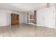 Bright living room with tile floors and built-in cabinet at 10343 W Prairie Hills Cir, Sun City, AZ 85351