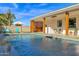 Modern backyard retreat with a sparkling pool, ample patio space, and a lush lawn at 1225 W Wood Dr, Phoenix, AZ 85029