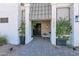 Inviting entryway with brick walkway and lush landscaping at 1225 W Wood Dr, Phoenix, AZ 85029