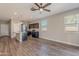 Open kitchen with island and dark cabinets at 1263 E Denvil Dr, Casa Grande, AZ 85122