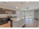 Modern kitchen with granite island and stainless steel appliances at 1263 E Denvil Dr, Casa Grande, AZ 85122