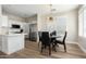 Modern kitchen with white cabinets and stainless steel appliances at 1314 E Thompson Way, Chandler, AZ 85286