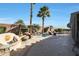 Large backyard with spa, fire pit, and patio area at 15938 W Summerwalk Dr, Surprise, AZ 85374
