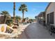 Spacious backyard with a spa, patio, and seating areas at 15938 W Summerwalk Dr, Surprise, AZ 85374