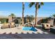 Inviting backyard with spa, seating, and landscaping at 15938 W Summerwalk Dr, Surprise, AZ 85374