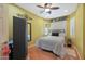 Bright bedroom with a queen-size bed and window shutters at 15938 W Summerwalk Dr, Surprise, AZ 85374