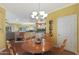 Round dining table with four chairs in bright dining area at 15938 W Summerwalk Dr, Surprise, AZ 85374