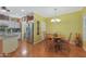 Cozy dining area with hardwood floors and chandelier at 15938 W Summerwalk Dr, Surprise, AZ 85374