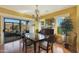 Bright dining room with hardwood floors and patio access at 15938 W Summerwalk Dr, Surprise, AZ 85374