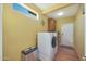 Convenient laundry room with washer, dryer, and extra storage at 15938 W Summerwalk Dr, Surprise, AZ 85374