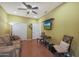 Cozy living room featuring comfortable seating and hardwood floors at 15938 W Summerwalk Dr, Surprise, AZ 85374