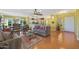 Bright living room featuring hardwood floors and comfortable seating at 15938 W Summerwalk Dr, Surprise, AZ 85374