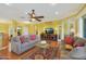 Living room with hardwood floors and comfortable seating at 15938 W Summerwalk Dr, Surprise, AZ 85374