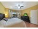 Bright bedroom with backyard views and a large bed at 15938 W Summerwalk Dr, Surprise, AZ 85374