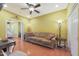 Home office with a comfortable couch and built-in shelving at 15938 W Summerwalk Dr, Surprise, AZ 85374