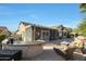 Outdoor patio with seating area, fire pit, and built-in barbecue at 15938 W Summerwalk Dr, Surprise, AZ 85374