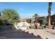 Cozy patio features fire pit and comfortable seating area at 15938 W Summerwalk Dr, Surprise, AZ 85374
