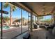 Covered patio with comfortable seating overlooking the pool at 15938 W Summerwalk Dr, Surprise, AZ 85374